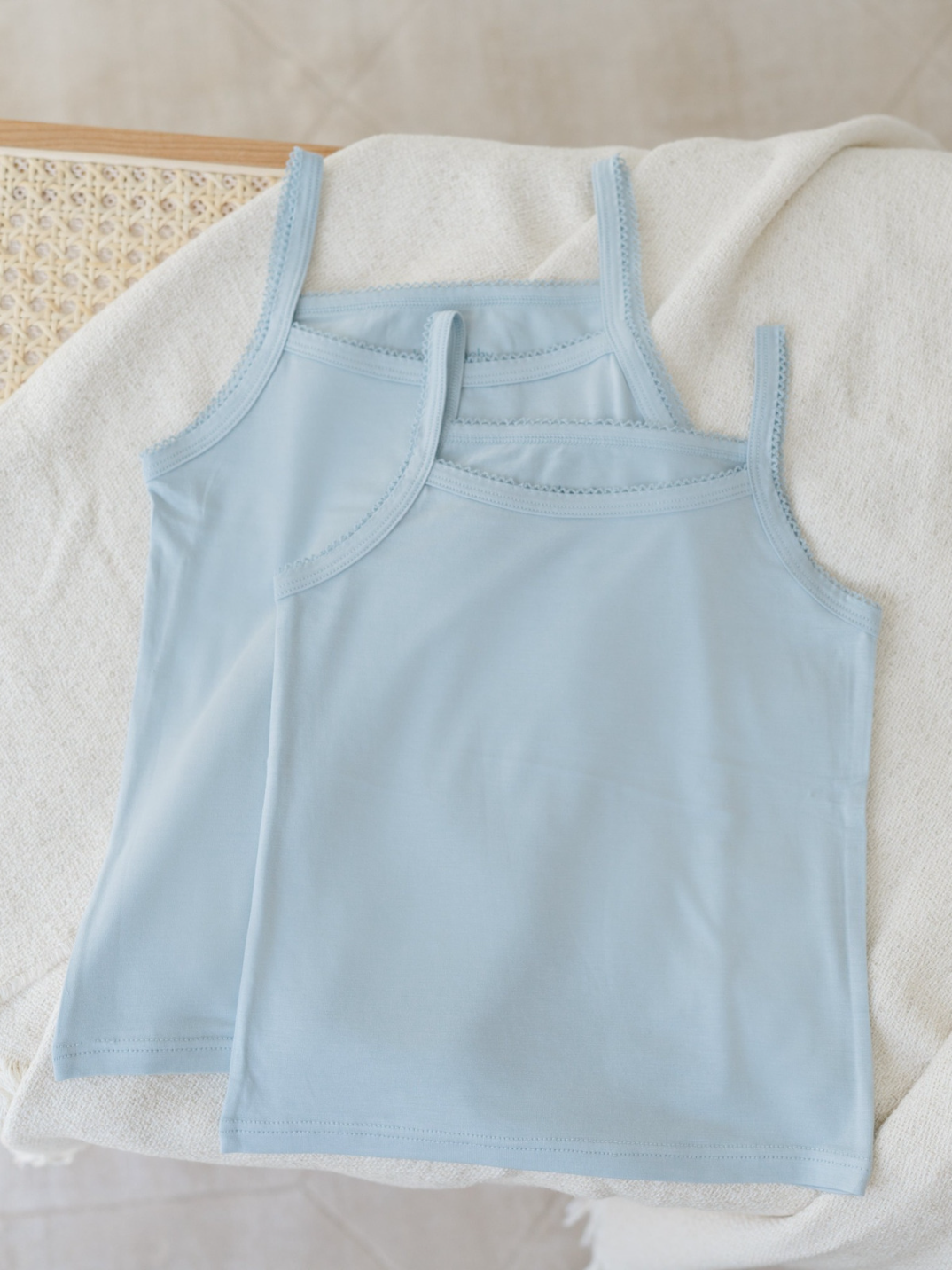 Kids camisoles blue trendy children's fashion sustainable brand eco-friendly Just Peachy Underwear is crafted in TENCEL™ Modal, fibers extracted from naturally grown beech wood by an environmentally responsible integrated pulp-to-fiber process. The FSC and Oeko Tex certified modal is biodegradable, free from harmful chemicals and interwoven using Micro technology for a finer quality of lightness and the softest touch.