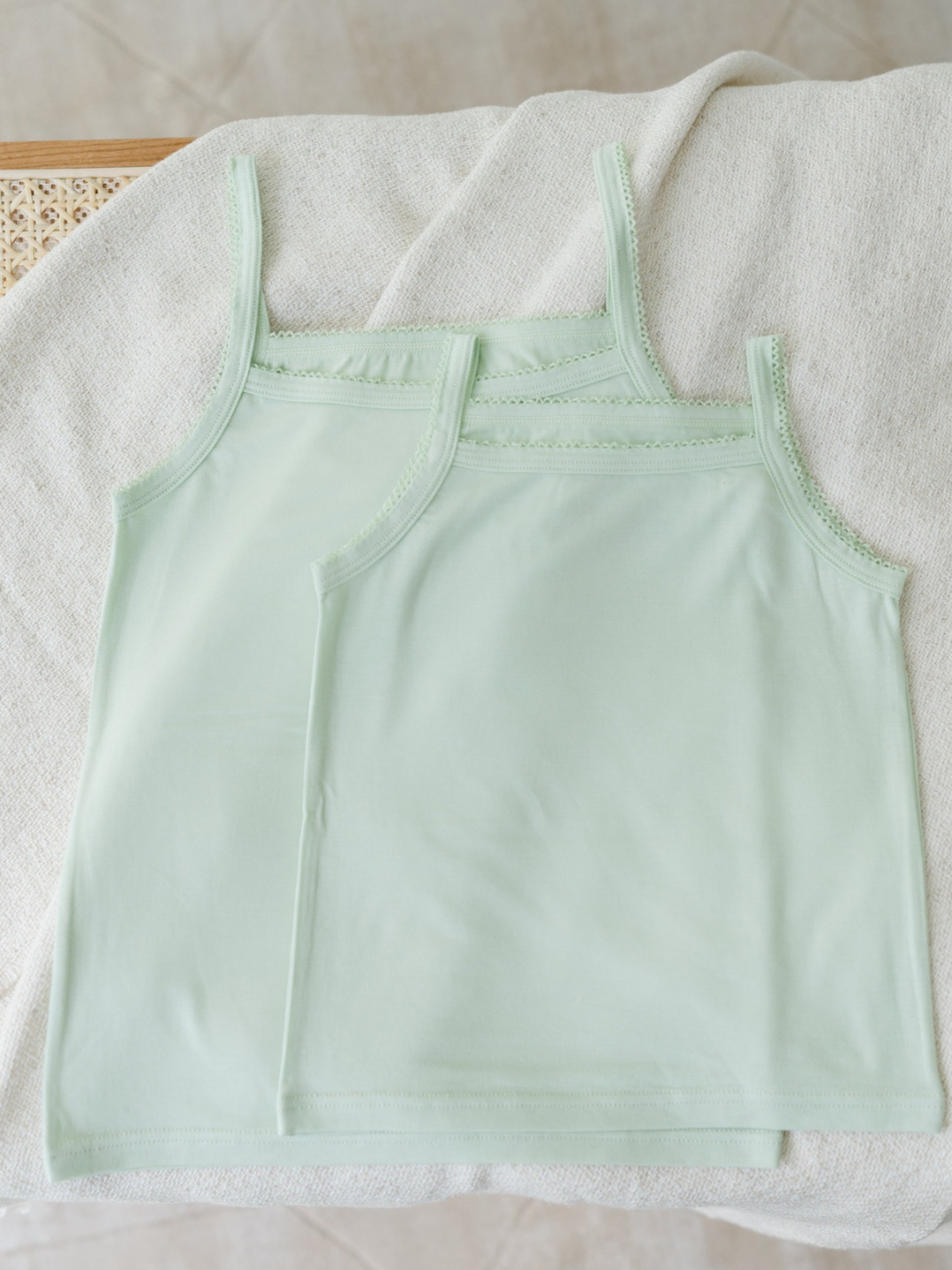 Kids camisoles light green trendy children's fashion sustainable brand eco-friendly Just Peachy Underwear is crafted in TENCEL™ Modal, fibers extracted from naturally grown beech wood by an environmentally responsible integrated pulp-to-fiber process. The FSC and Oeko Tex certified modal is biodegradable, free from harmful chemicals and interwoven using Micro technology for a finer quality of lightness and the softest touch.