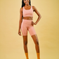 essential short peach pink sustainable activewear made from recycled plastic bottles