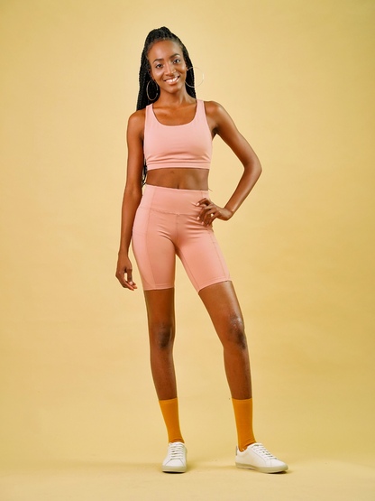 essential short peach pink sustainable activewear made from recycled plastic bottles