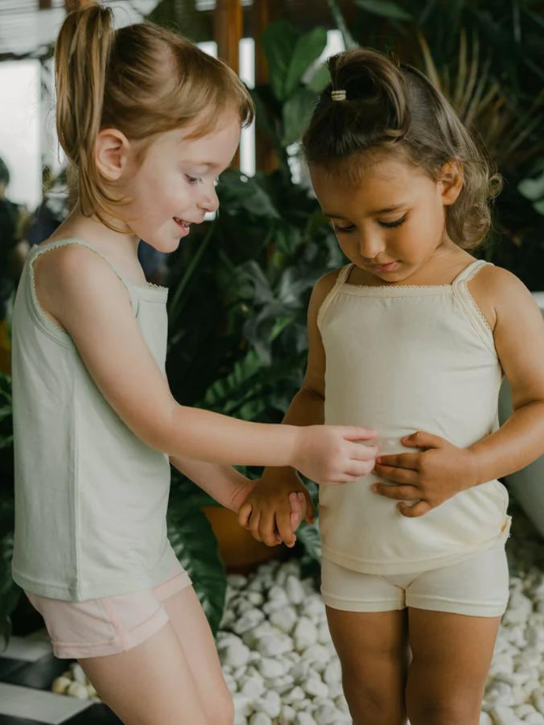 Just Peachy Camisoles are super soft and gentle on your little ones' skin. Designed with a snug fit for play, movement and a comfy night's rest. Add the breathable Camisole layer under your day clothes or snooze in maximum comfort. Made with Lenzing® TENCEL™ Micro Modal Fibers interwoven with Eco Soft Technology exclusively for Just Peachy. Green and cream kids super comfortable kids camis. Sustainable eco-friendly brand.