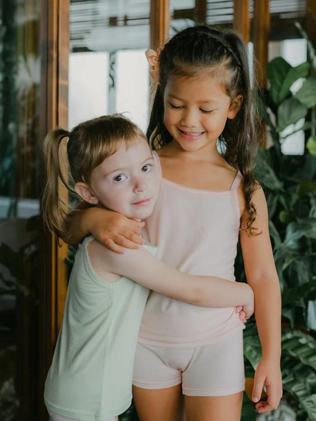 Just Peachy Camisoles are super soft and gentle on your little ones' skin. Designed with a snug fit for play, movement and a comfy night's rest. Add the breathable Camisole layer under your day clothes or snooze in maximum comfort. Pink and green children's camis. Comes in a 2-pack