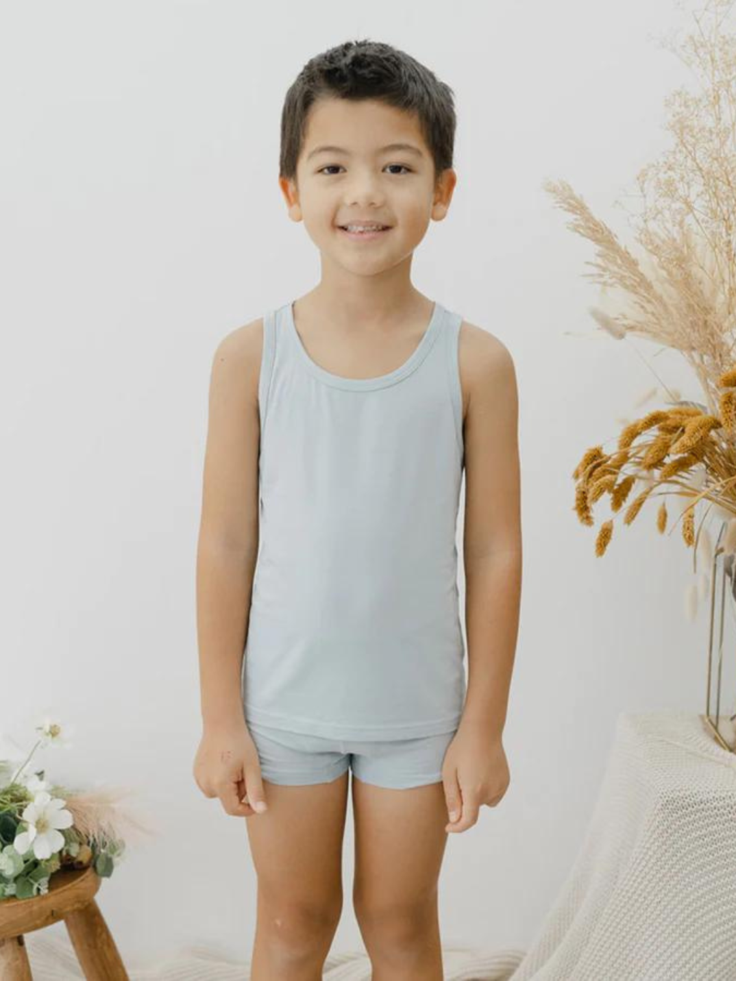 These tank tops are super soft and gentle on your little ones' skin. Designed with a loose, unisex fit for play, movement and a comfy night's rest. Wear the breathable layer under garments for day or snooze in the ultimate comfort. Made with modal interwoven with eco-soft technology. Comes with: 2x blue tank tops.