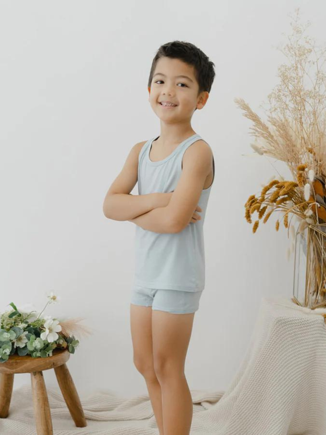 These tank tops are super soft and gentle on your little ones' skin. Designed with a loose, unisex fit for play, movement and a comfy night's rest. Wear the breathable layer under garments for day or snooze in the ultimate comfort. Made with modal interwoven with eco-soft technology. Comes with: 2x blue tank tops.