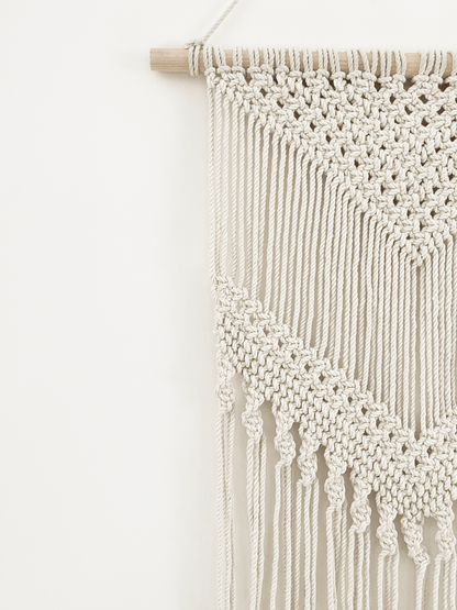 Our handcrafted macramé hanging tapestry is a a beautiful combination of a modern Bohemian style.
