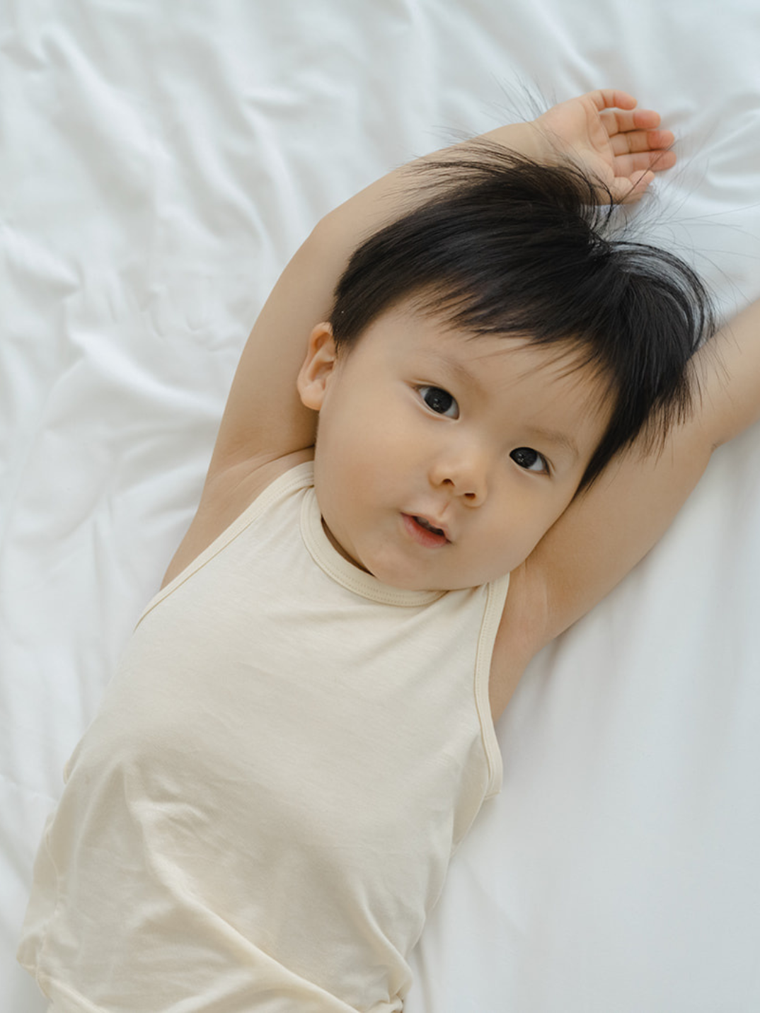 These tank tops are super soft and gentle on your little ones' skin. Designed with a loose, unisex fit for play, movement and a comfy night's rest. Wear the breathable layer under garments for day or snooze in the ultimate comfort. Made with modal interwoven with eco-soft technology. Comes with: 2x cream tank tops.