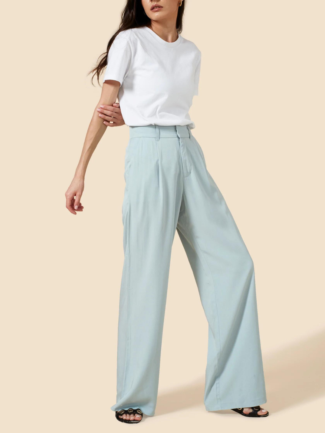No capsule wardrobe is complete without that perfect pair of wide leg pants. Cut from an ultra-soft, lightweight natural fiber, the Willow Wide Leg Pants are a high-waisted design that elongate the silhouette. Featuring an elastic back waistband and side pockets, these pants guarantee tailored comfort. Ideal for an effortlessly cool look with sneakers, or occasion dressing with heels. Create a matching co-ordinated set with The Noah Blazer.