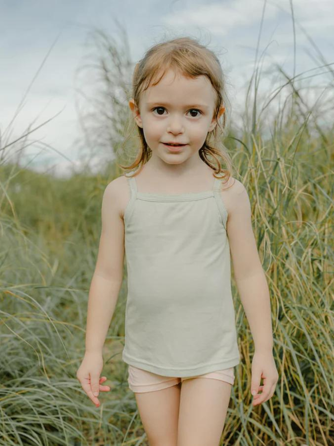 Kids camisoles light green trendy children's fashion sustainable brand eco-friendly Just Peachy Underwear is crafted in TENCEL™ Modal, fibers extracted from naturally grown beech wood by an environmentally responsible integrated pulp-to-fiber process. The FSC and Oeko Tex certified modal is biodegradable, free from harmful chemicals and interwoven using Micro technology for a finer quality of lightness and the softest touch.