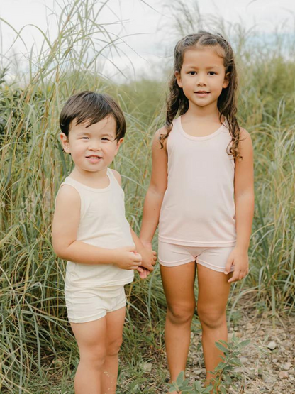 These tank tops are super soft and gentle on your little ones' skin. Designed with a loose, unisex fit for play, movement and a comfy night's rest. Wear the breathable layer under garments for day or snooze in the ultimate comfort. Made with eco modal fabric. Comes with: 1x pink tank top and 1x cream tank top.