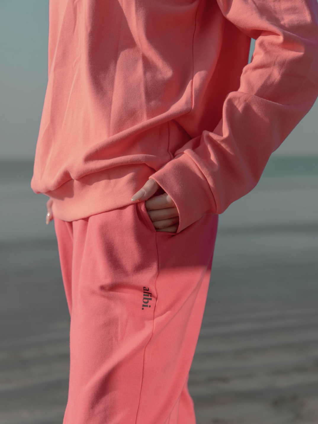coral sweatshirt that's water-resistant, bacterially-defensive and ecologically-sustainable.