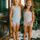These tank tops are super soft and gentle on your little ones' skin. Designed with a loose, unisex fit for play, movement and a comfy night's rest. Wear the breathable layer under garments for day or snooze in the ultimate comfort. Made with eco modal fabric. Comes with: 1x pink tank top and 1x blue tank top.