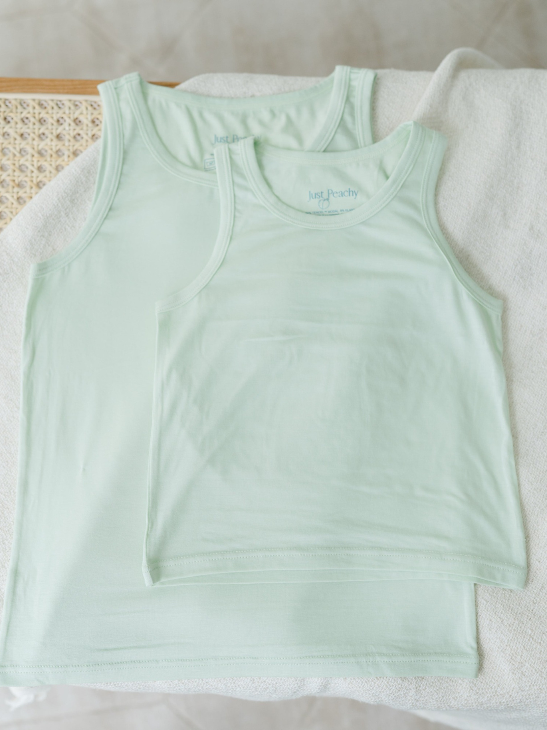 These tank tops are super soft and gentle on your little ones' skin. Designed with a loose, unisex fit for play, movement and a comfy night's rest. Wear the breathable layer under garments for day or snooze in the ultimate comfort. Made with modal interwoven with eco-soft technology. Comes with: 2x green tank tops.