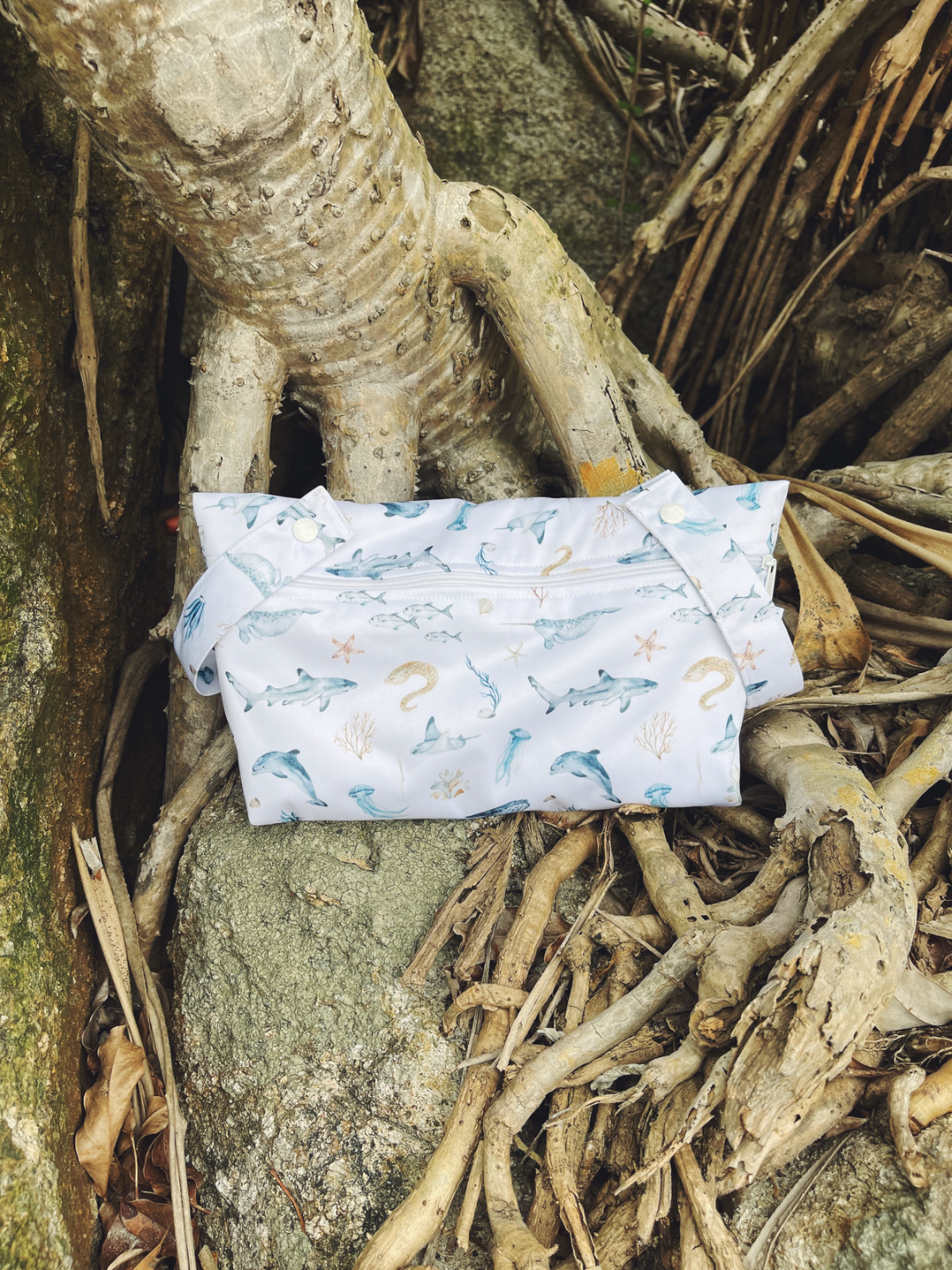 This Little Essentials double-lined, waterproof pouch is perfect for keeping your diaper bag or mommy/daddy bag organized! It’s the perfect size for all your little one’s little essentials that you need to access easily, whether it’s on a walk to the park, long-haul travel or cot-side and by your changing station.