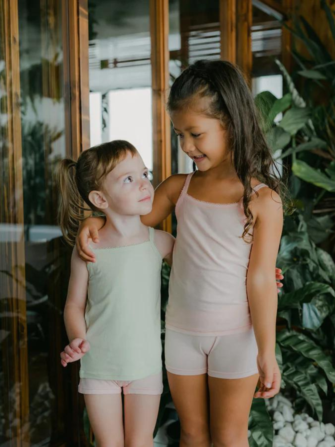 Just Peachy Camisoles are super soft and gentle on your little ones' skin. Designed with a snug fit for play, movement and a comfy night's rest. Add the breathable Camisole layer under your day clothes or snooze in maximum comfort. Pink and green children's camis. Comes in a 2-pack
