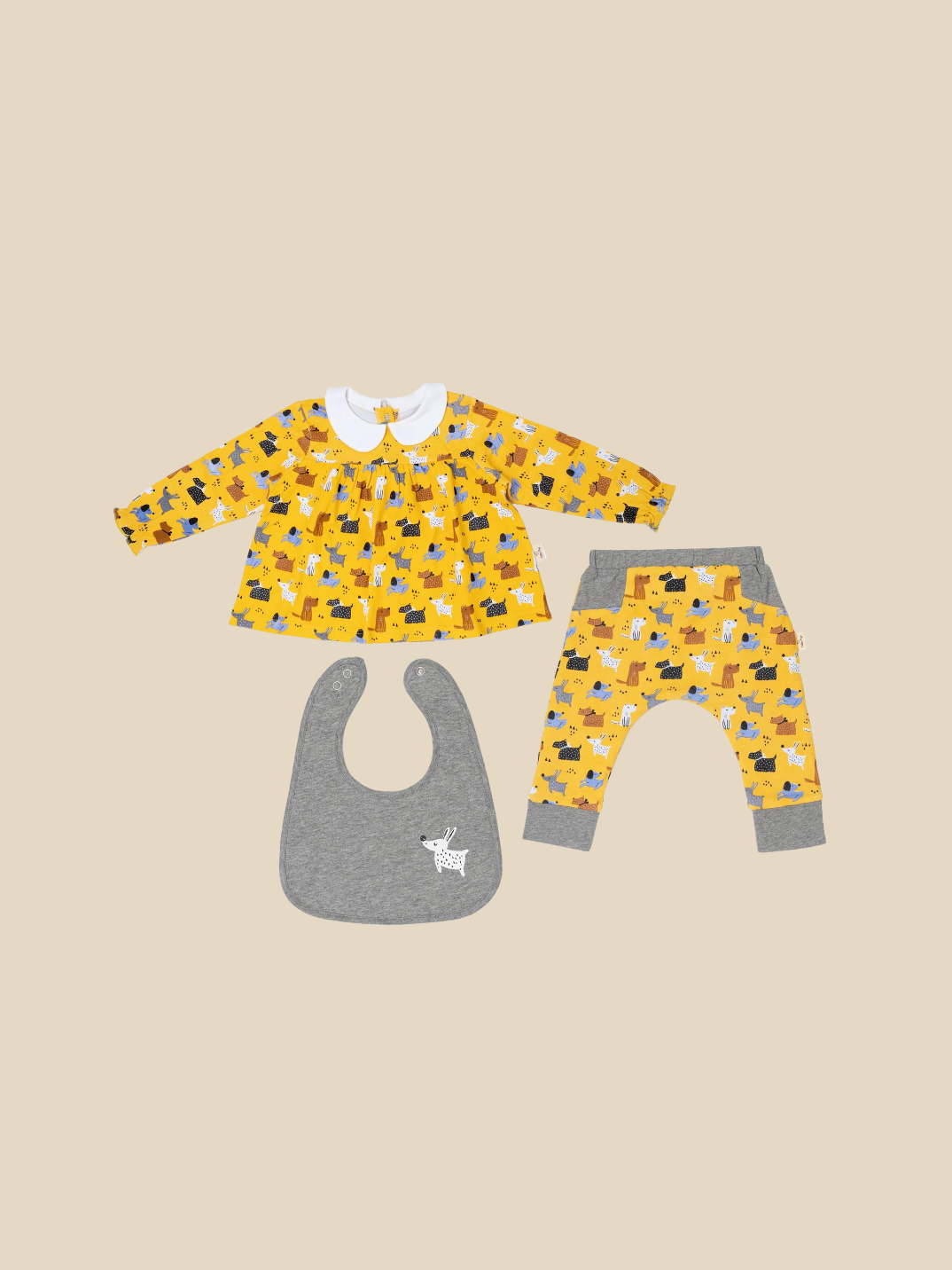Our sweet teatime blouse with a cute peter pan collar and matching reversible pants with bib will delight you and your baby. Super-soft with puffy sleeves and an easy-to-wear design with snaps designed at the back of the blouse. Shop now.