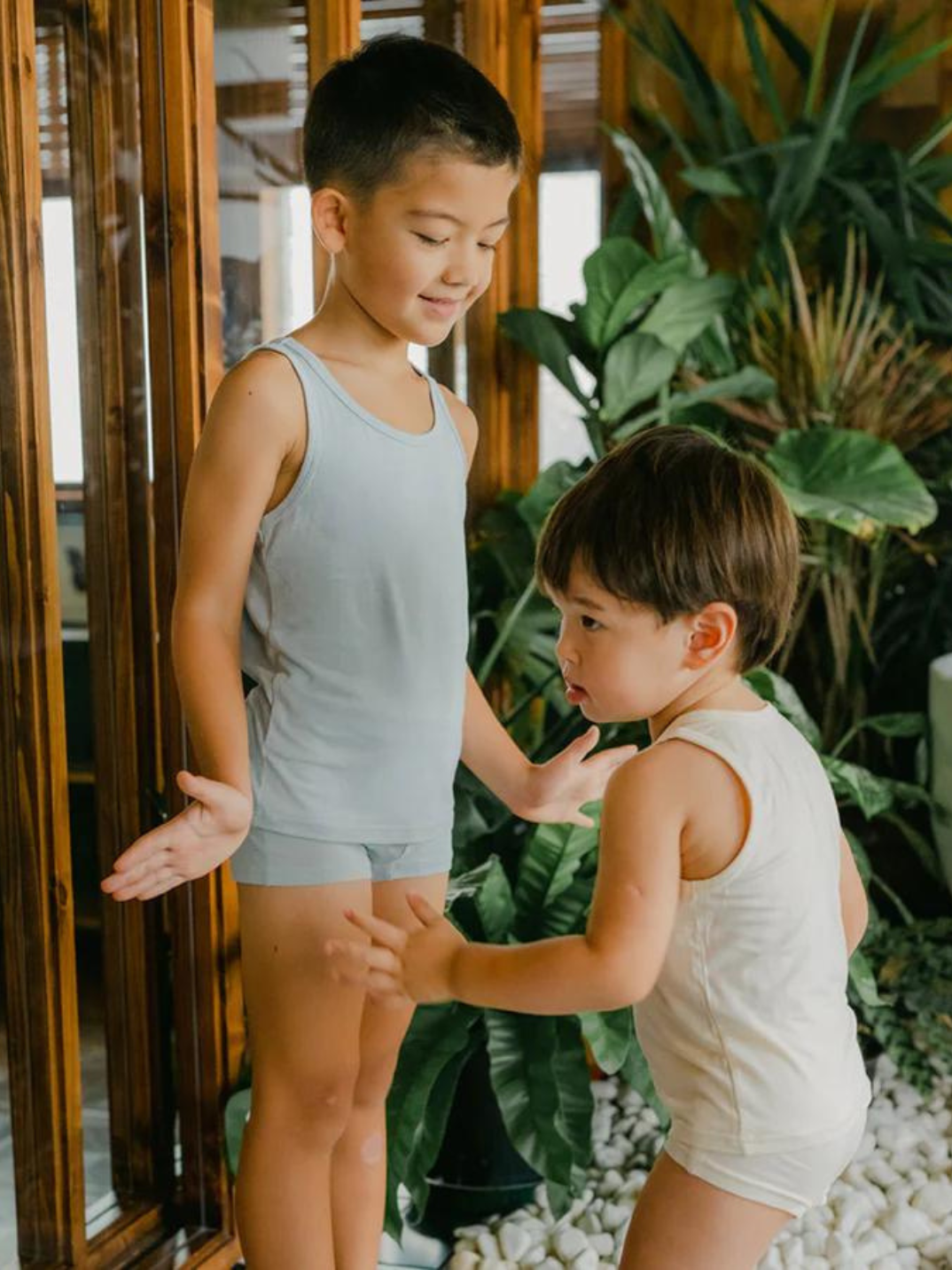 These tank tops are super soft and gentle on your little ones' skin. Designed with a loose, unisex fit for play, movement and a comfy night's rest. Wear the breathable layer under garments for day or snooze in the ultimate comfort. Made with eco modal fabric. This set comes with: 1x blue tank top and 1x cream tank top.