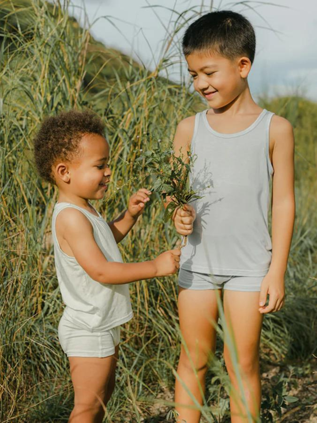These tank tops are super soft and gentle on your little ones' skin. Designed with a loose, unisex fit for play, movement and a comfy night's rest. Wear the breathable layer under garments for day or snooze in the ultimate comfort. Made with eco modal fabric. This set comes with: 1x green tank top and 1x blue tank top.