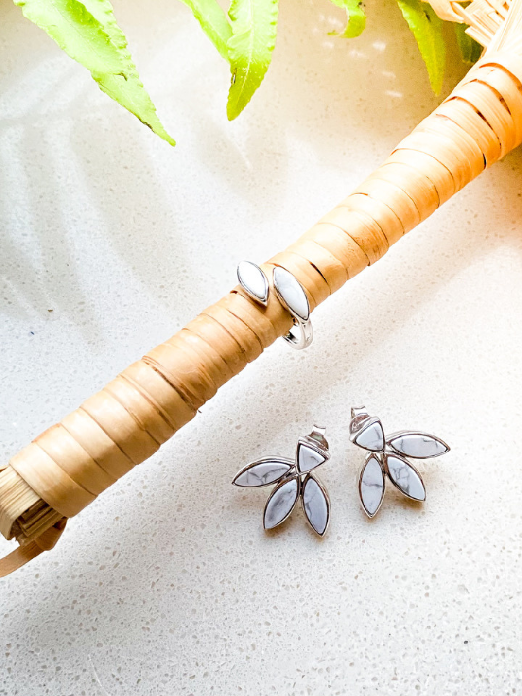 Sterling silver floral escape earrings inlaid with hand cut white magnesite. We just love the grey marble effect on this naturally white semi precious stone, each gemstone unique much like your own beauty. ethical jewelry sustainable fashion