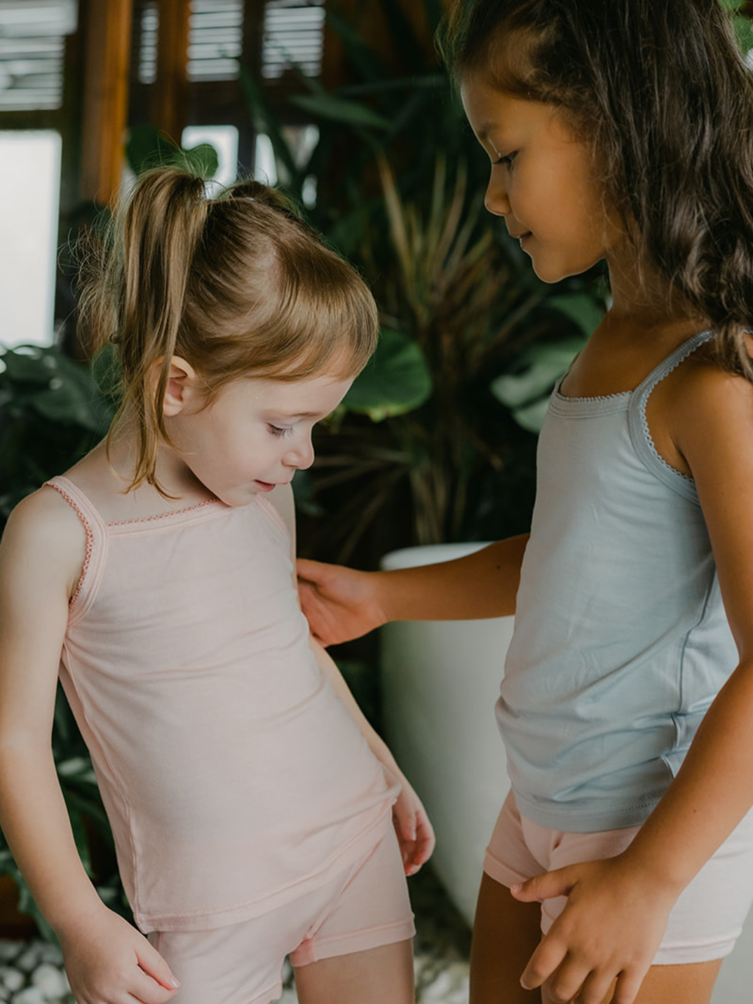 Just Peachy Camisoles are super soft and gentle on your little ones' skin. Designed with a snug fit for play, movement and a comfy night's rest. Add the breathable Camisole layer under your day clothes or snooze in maximum comfort. Pink and blue children's camis. Comes in a 2-pack