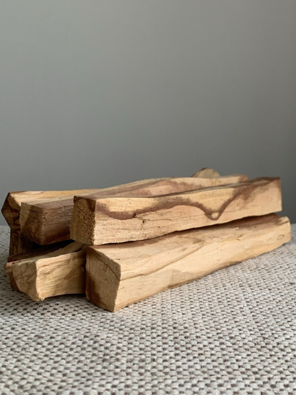 Burn Palo Santo sticks at home or in your office to help clear the air and refresh your space.