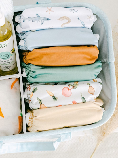 Take it with you. Just Peachy's diaper caddy is lightweight, with the handles on the sides, it is easy to carry from your changing station to any other room at home or even in the car or plane!