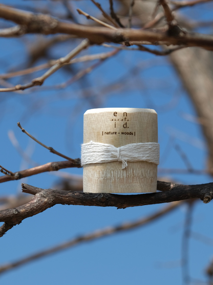 woods candle nature inspired scent soy wax eco-friendly ethically-made handmade candle shop eco gifts natural woman-owned brand shop sustainable bamboo massage candles
