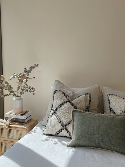 Made with a soft tufted cotton front and minimal checkered pattern, this cushion can very easily fit into any style.Eden cushion eco-friendly ethical bohemian home goods Casa Luna made in India shop sustainable